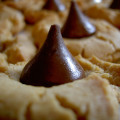 Close-up shot of Peanut Butter Blossom cookies on a cookie sheet